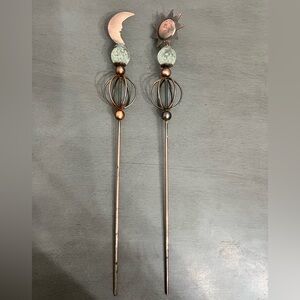 Coppery-colored Sun and Moon plant pot decor